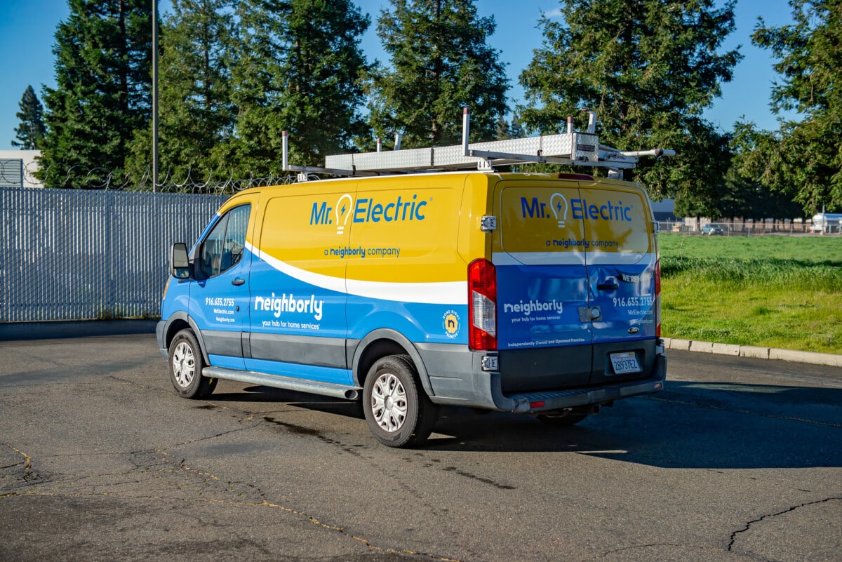 Fleet vehicle with completed wrap showcasing brand colors and logo, installed by Pro Wraps Vehicle Wraps. 