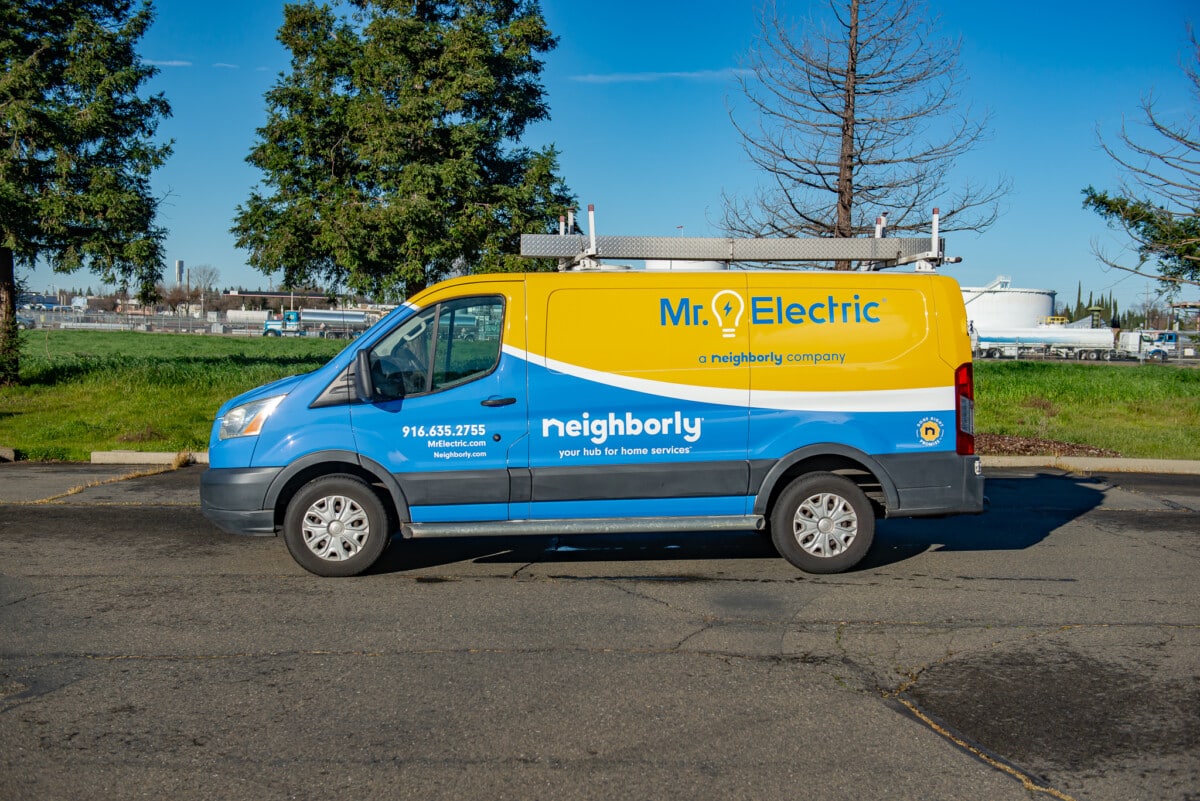 Van advertising wrap with large logo and contact information, designed by Pro Wraps Vehicle Wraps 