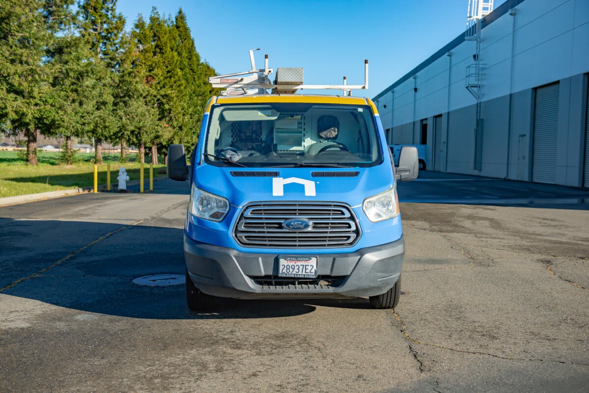 Branded company car wrap tailored for visibility and professionalism, done by Pro Wraps Vehicle Wraps. 