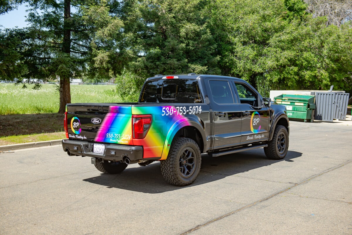 Side view of high-quality vinyl wrap application on a work truck