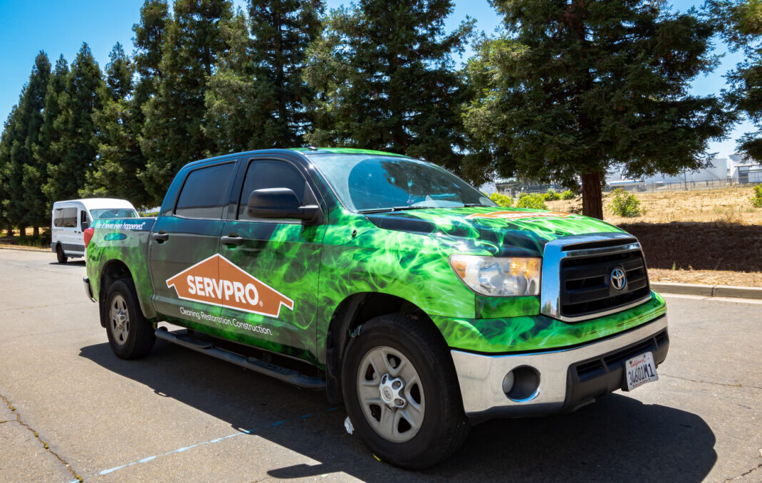moving advertisement for SERVPRO with bold vehicle wrap.