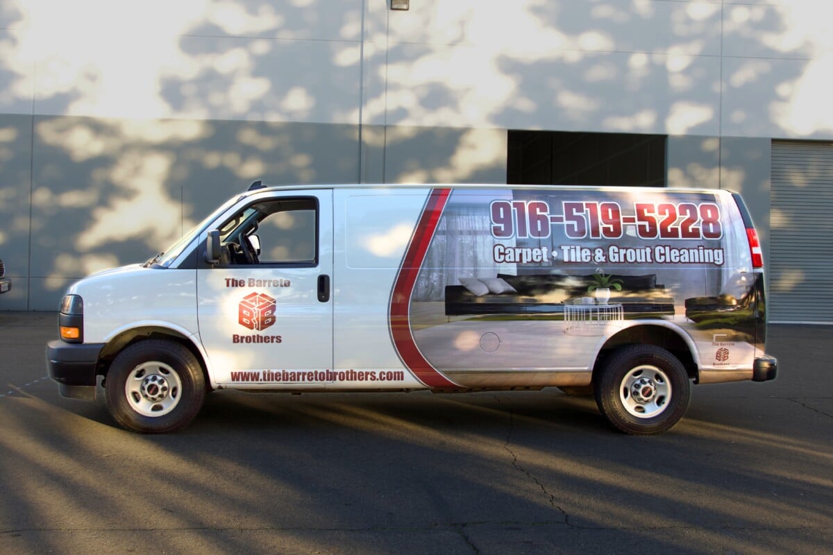 Side-view of a carpet cleaning van featuring a refreshed brand design.